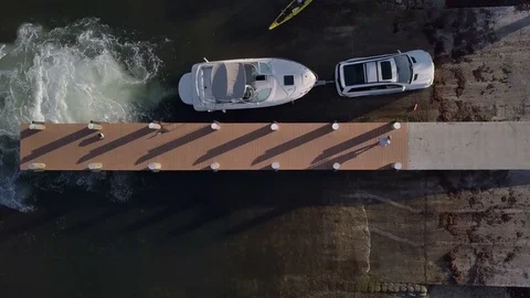 Over Head Shot Of A Boat Loading On To A Trailer At A Marina Dock Stock-Footage 79447455