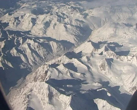 Over the Himalayas - view from plane window Stock Footage 401640