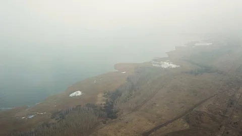 Over the icy lake through the clouds Stock Footage 116591882