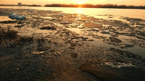 Over the icy river to the sun Stock Footage 89608351