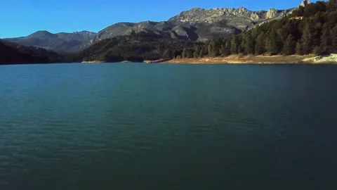 Over lake with mountains in the background Stock Footage 239558170