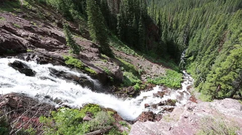 Over looking high mountain water fall cascade Stock Footage 40704127
