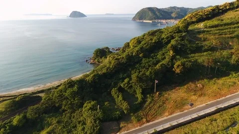Over the mountain to clear sea  view in rural area west Japan , aerial Stock Footage 108044575