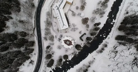 Over a mountain river in a landscape covered with snow Stock Footage 92520802