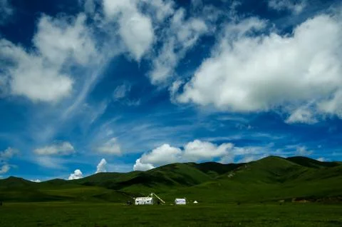 Over the mountains is a thin layer of clouds Stock Photos