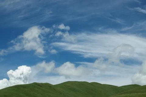 Over the mountains is a thin layer of clouds Stock Photos