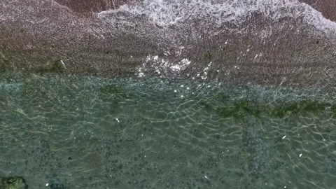 Over Ocean Waves to Parasol Umbrella on Sandy Beach Stock Footage 341531289