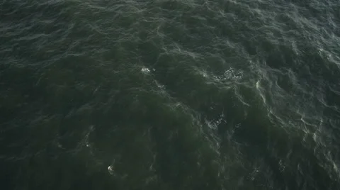 Over open ocean off the New Jersey coast. at 200 feet elevation. No horizon. Stock Footage 59219273