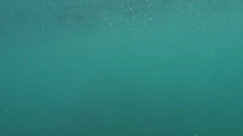 Over open sea, camera goes under, then up: echoing a drowning individual's PO Stock Footage 254469573