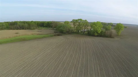 Over the opened rural  field and lake. Aerial Stockbeeldmateriaal 40591679