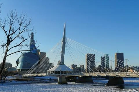 Over the Red River. Winter view on Esplanade Riel bridge with Canadian Museum Stock Photos