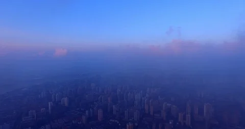 Over The Sea Of ​​Clouds - Aerial View Of Skyscraper In Shanghai At Day. Stock Footage 124252322