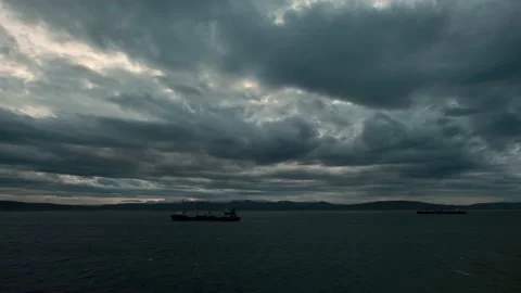 Over the sea with the ships clouds float. Stock Footage 143650253