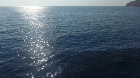 Over the sea surface with glaring sunbeams Video stock 273253903