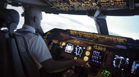 Over the shoulder of African-American pilot banking 747 4K Stock Footage 53202253