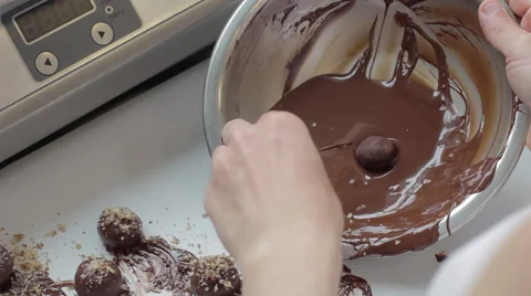 Over shoulder of baker making chocolate mousse truffles by hand 스톡 동영상 60719865