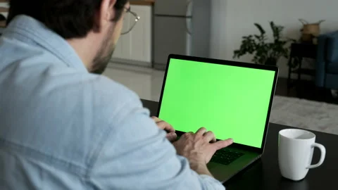 Over the Shoulder Camera Shot of Man at Home Sitting on a Couch Working Video stock 144235646