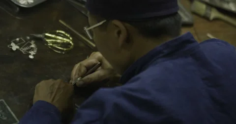 Over the shoulder craft working small object Stock Footage 141358697