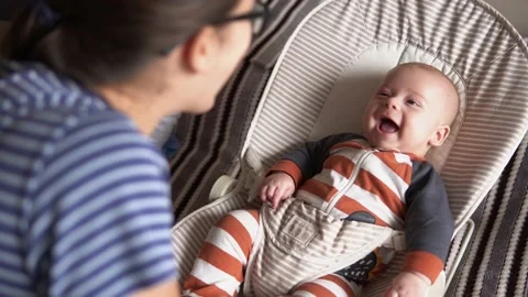Over the shoulder face to face hold Childhood, motherhood, family. Little Stock Footage 201309995