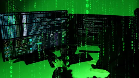 Over-shoulder hacker view in green room with code rain, slow cinematic zoom out 스톡 동영상 323041535