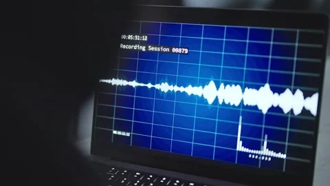Over the shoulder on laptop computer with audio sound waves of wiretapping Vídeo Stock 311302305