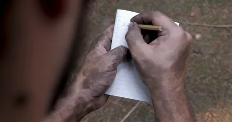 Over the shoulder look at me scribbling fake notes into a notebook Stock Footage 111741624