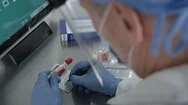 Over The Shoulder Look Of Medical Personnel Working On Covid-19 Kit Stock Footage