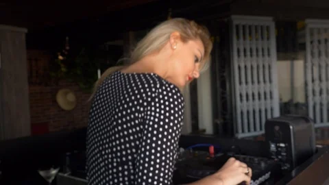 Over the shoulder pretty lady dances at bar Stock Footage 87397151