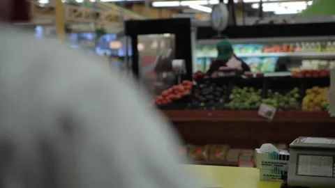 Over the shoulder shot of a baker looking into grocery store. Stock Footage 231414481