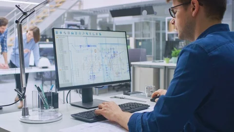 Over the Shoulder Shot of Engineer Working with CAD Software on Desktop Computer Video stock 107773529