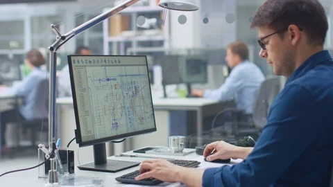 Over the Shoulder Shot of Engineer Working with CAD Software on Desktop Computer Stock-Footage 107780446