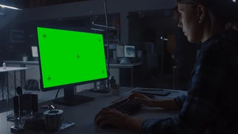 Over the Shoulder Shot of Engineer Working with Green Mock-up Screen Desktop PC Stock Footage 107804509