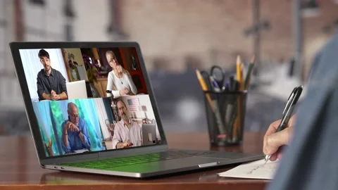 Over the shoulder shot of hand taking notes remote working on modern laptop with Video stock 196607289