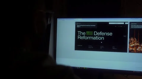 Over the shoulder shot of an man checking Palantir Technologies website on a Stock Footage 306920187