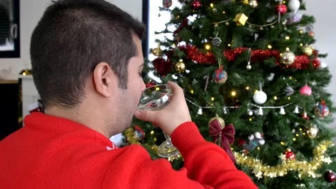 Over the shoulder shot of middle age man drinking champagne in a saucer Stock Footage 140824909