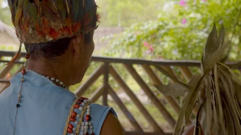 Over the shoulder shot of an old indigenous shaman performing a magical ritual Stock Footage 113178633
