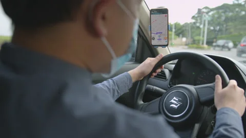 Over The Shoulder Slow Motion Shot Of Driver Wearing Face Mask Driving Vídeo Stock 142525868