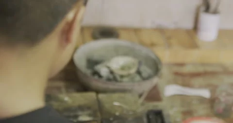 Over the shoulder using blowtorch Stock Footage 141366327