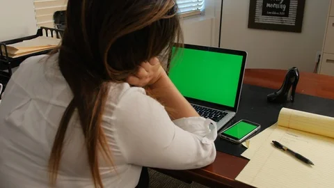 Over shoulder view of 2 screens with green screens Stock-Footage 118636400