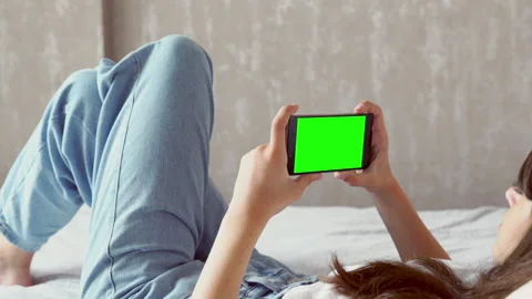 Over the shoulder view of a blank mobile phone Stock Footage 136692995