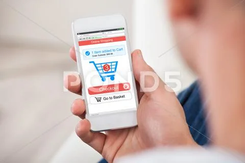 Over the shoulder view of the blank screen on a smartphone Stock Photos