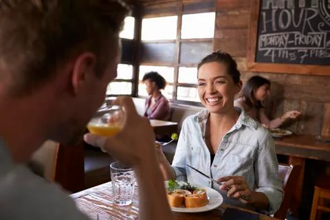 Over shoulder view of couple having lunch in a restaurant Fotos Stock