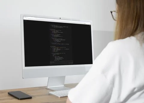Over shoulder view of developer vibe coding with artificial intelligence AI.. Photos