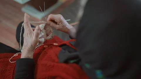 Over Shoulder View of Elderly Woman Knitting Wool Socks 스톡 동영상 334085366