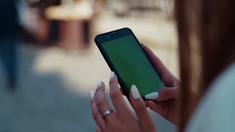 Over shoulder view of female hands with stylish trendy manicure actively tapping Stock Footage 112673339