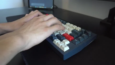Over the Shoulder View of Hands Typing on Keyboard Stock Footage 341832893
