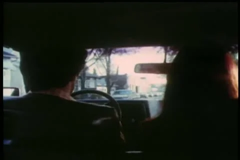 Over the shoulder view of man and woman driving in car 스톡 동영상 11345909