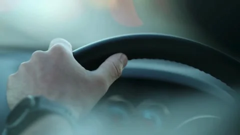 Over shoulder view of man driving car. Close up shot of male hands on steering Stock-Footage 336265397