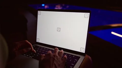 Over Shoulder View Of Person Using Laptop With Blank Screen Mockup Near Illumina Stock Footage 336728849