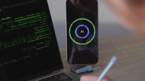 Over shoulder view of programmer writing notes from AI assistant near laptop Vidéo 346834851